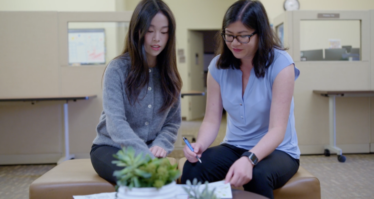 UC Irvine student apprentice Alina Yuan, left, collaborates with marketing program manager Kimberly Chai on design concepts for Division of Career Pathways materials at UC Irvine.