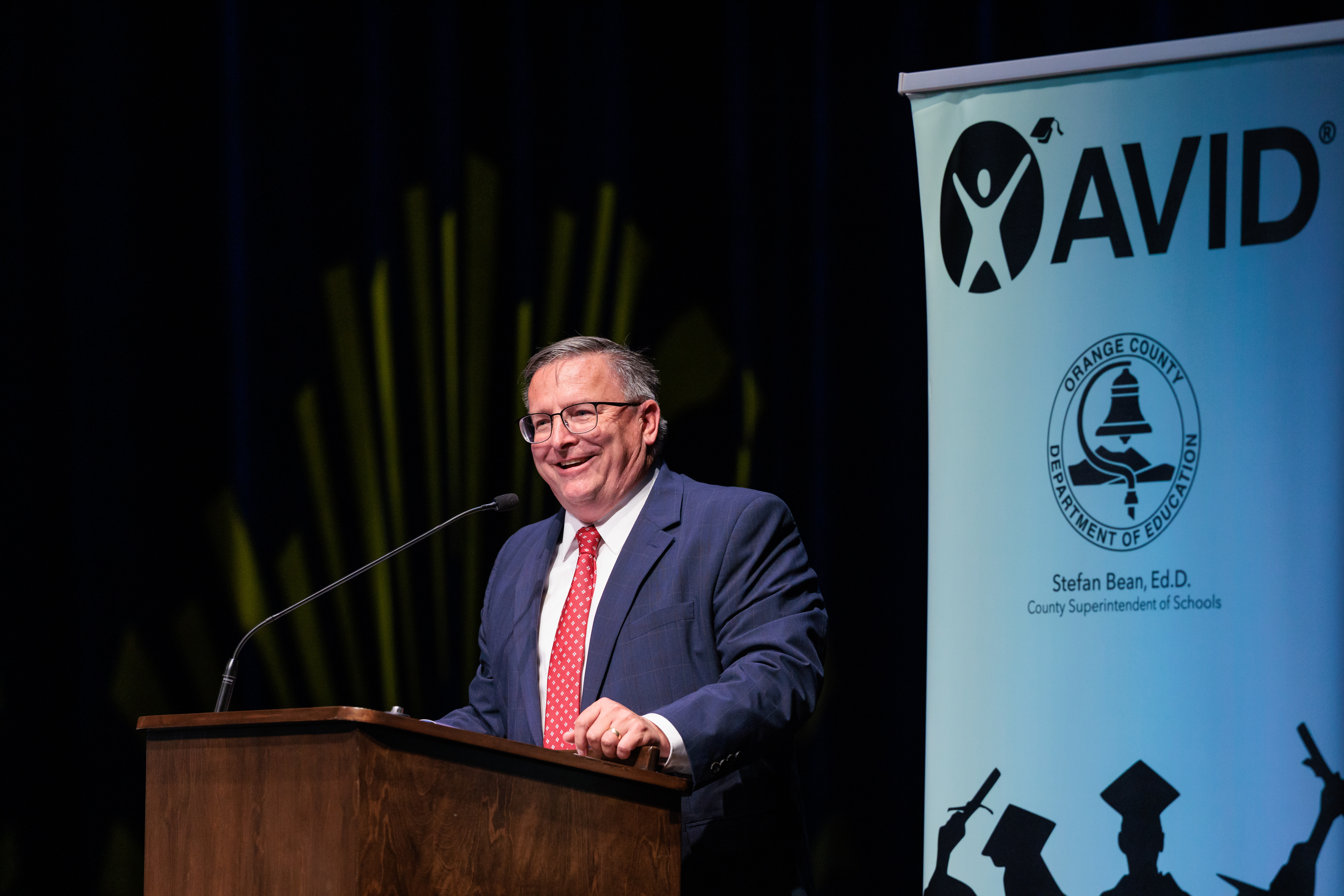 OCDE Chief of Staff Dennis Cole delivers remarks during the 2026 OC AVID Senior Standout Recognition and Scholarship Presentation.
