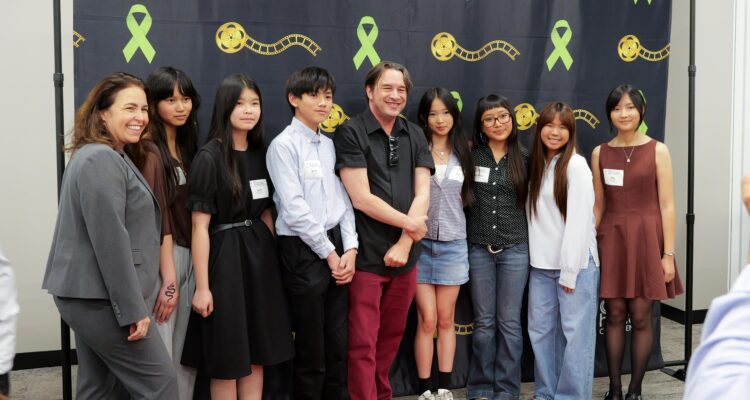 Warner Middle School students attend the May 1 Directing Change Youth Choice Awards alongside their advisor Kurt Reisig and assistant principal Dr. Marika Manos.