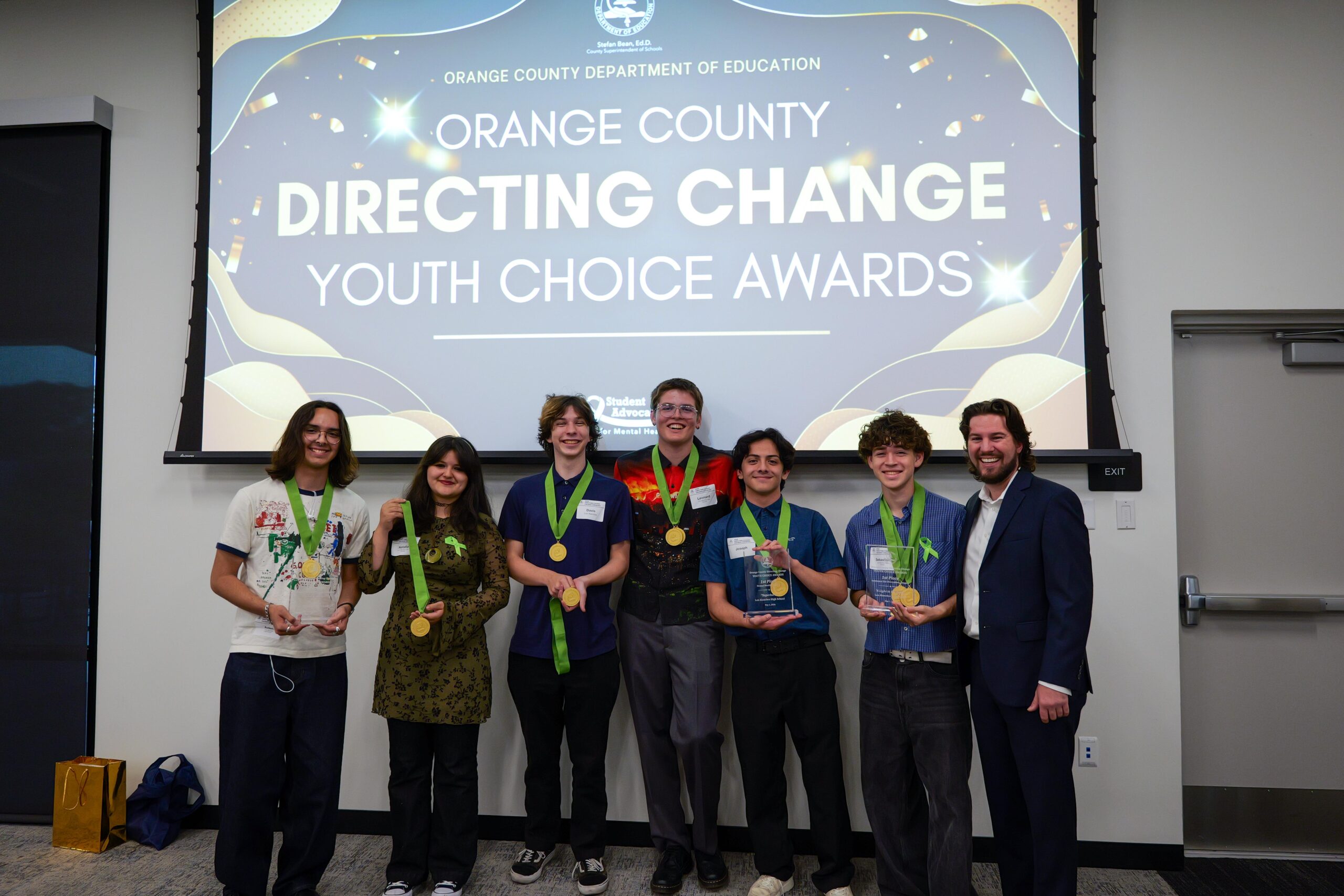 Los Alamitos High School students pose with their winning medals and plaques alongside their school advisor Conner Brown at the inaugural OC Directing Change Youth Choice Awards May 1.