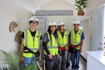 Nicolas Jr. High students from the Construction Academy stand inside the new 192-square-foot Tiny Home they helped construct at the May 22 ribbon-cutting ceremony. (Courtesy of Fullerton School District)