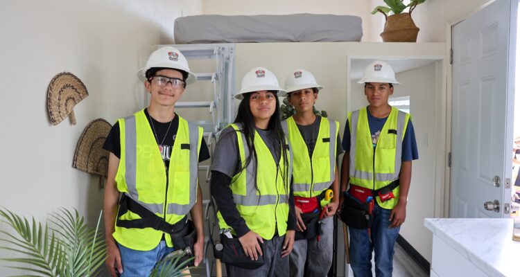 Nicolas Jr. High students from the Construction Academy stand inside the new 192-square-foot Tiny Home they helped construct at the May 22 ribbon-cutting ceremony. (Courtesy of Fullerton School District)