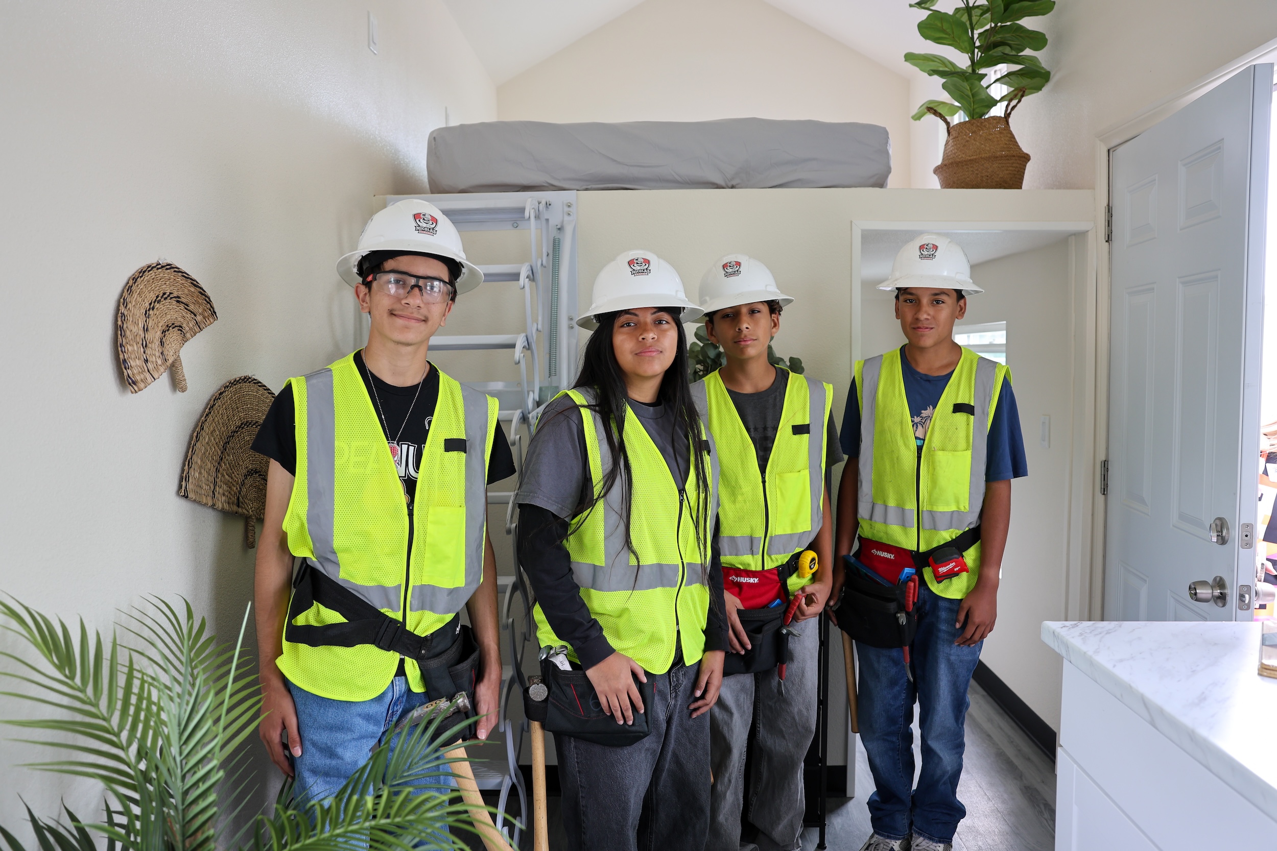 Nicolas Jr. High students from the Construction Academy stand inside the new 192-square-foot Tiny Home they helped construct at the May 22 ribbon-cutting ceremony. (Courtesy of Fullerton School District)