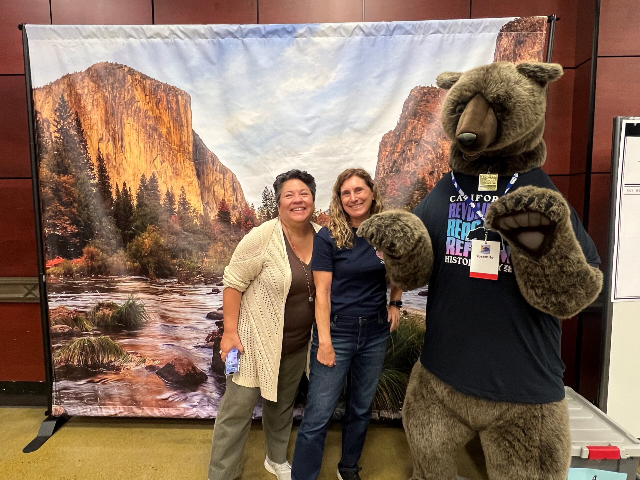 OCDE's NHD-OC Coordinators Virginia Reischl and Julie Hull pose with the NHD-CA mascot at the state finals May 3.