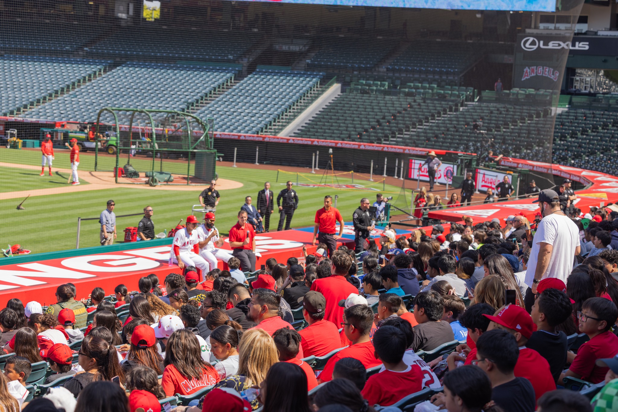 Los Angeles Angels players Jo Adell and Vaughn Grissom speak with students participating in the OC GRIP program at Angel Stadium on May 19.