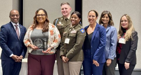From left, State Superintendent of Public Instruction Tony Thurmond, Raelene Velasquez, Command Sgt. Maj. Richard Aller, Sunburst Youth Academy Director Lt. Col. Sarah Rambo, Principal Dinah Ismail, OCDE Executive Director of Special Education Dr. Amita Cloke and OCDE Manager of Human Resources Support Services Lorena Villa pose for a photo during the 2026 California Classified School Employees of the Year recognition ceremony in Sacramento.