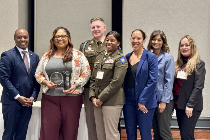 From left, State Superintendent of Public Instruction Tony Thurmond, Raelene Velasquez, Command Sgt. Maj. Richard Aller, Sunburst Youth Academy Director Lt. Col. Sarah Rambo, Principal Dinah Ismail, OCDE Executive Director of Special Education Dr. Amita Cloke and OCDE Manager of Human Resources Support Services Lorena Villa pose for a photo during the 2026 California Classified School Employees of the Year recognition ceremony in Sacramento.