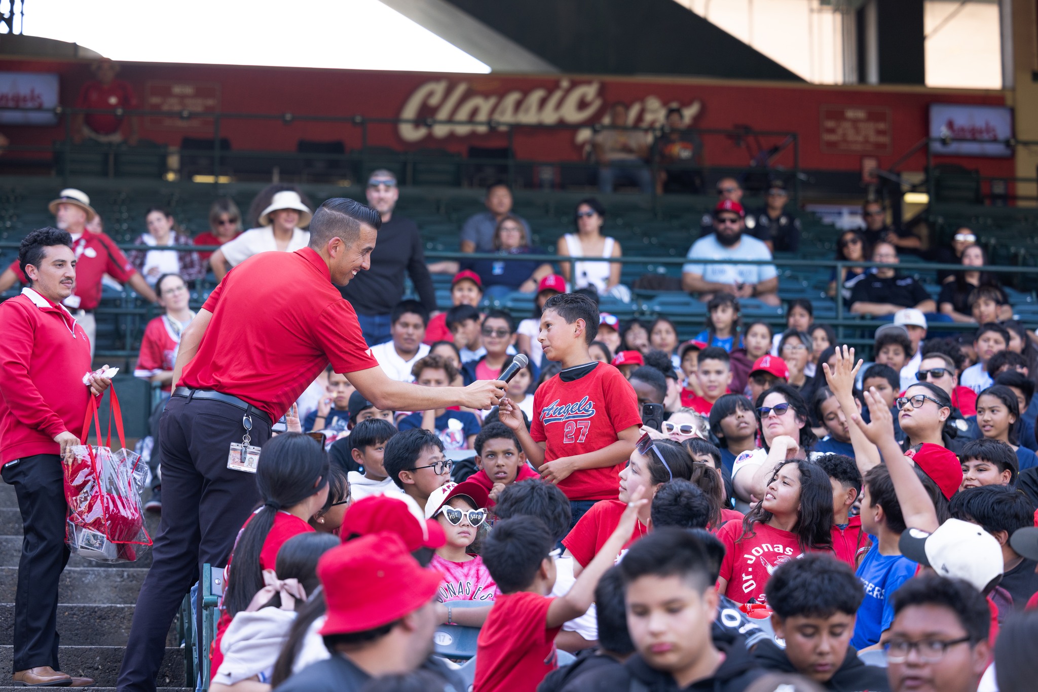 A student participating in the OC GRIP program speaks during a mentorship event at Angel Stadium before the Los Angeles Angels’ May 19 game against the Oakland Athletics.