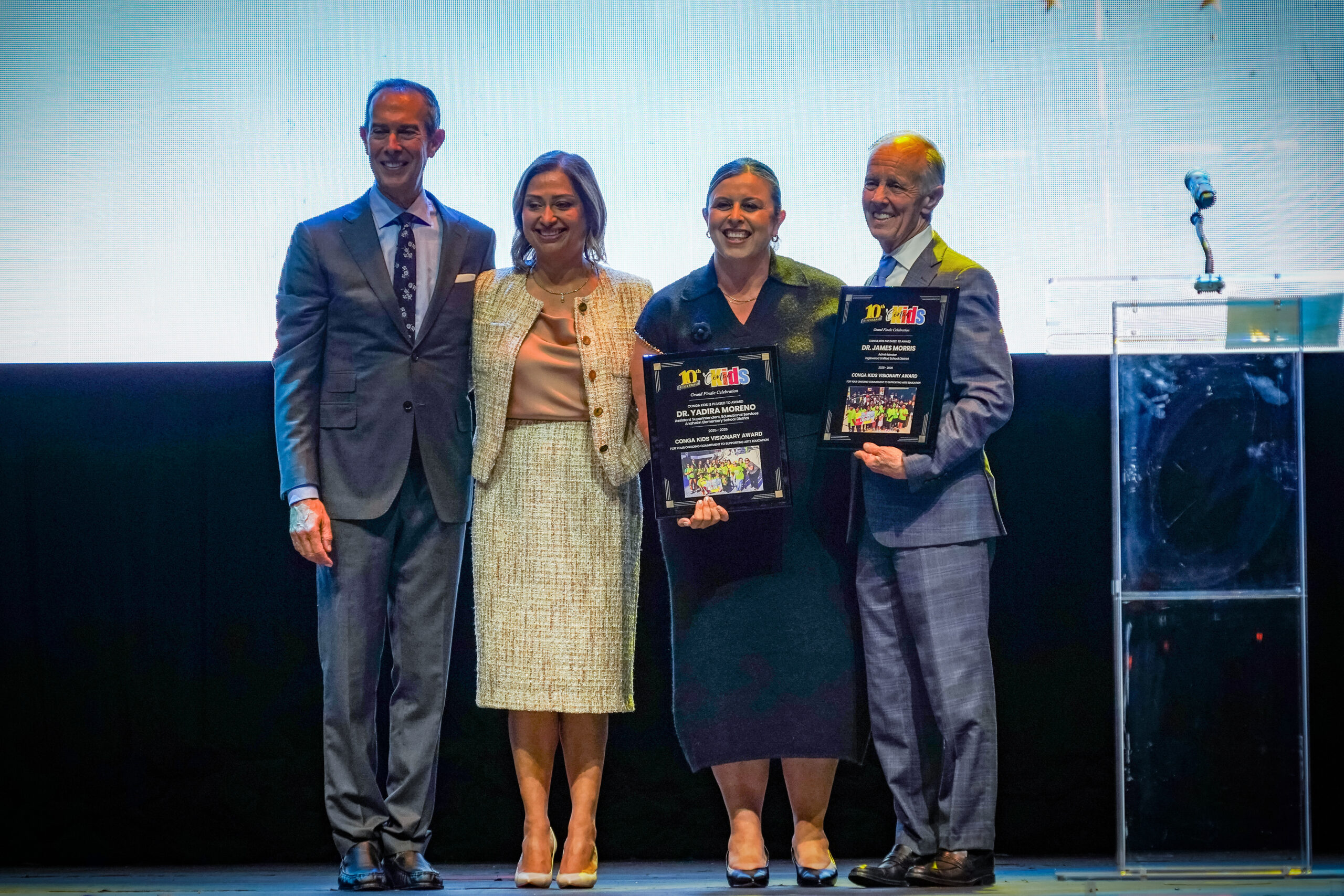 Anaheim Elementary School District Assistant Superintendent of Educational Services Dr. Yadira Moreno, second from left, receives a Visionary Award during the 2026 Conga Kids Dance Championship at The Novo at L.A. Live in Los Angeles on May 7.
