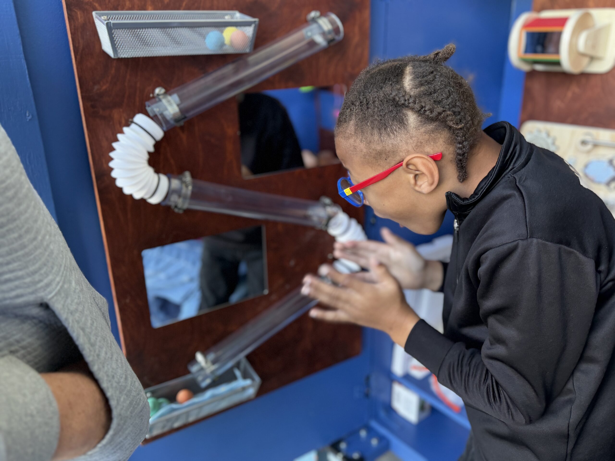 A Hopkinson Elementary School student uses a sensory station created by Los Alamitos High School freshman Wesley Avery to support students in the school’s Multi-Aged Huskies classroom.