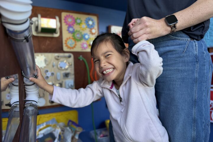 A Hopkinson Elementary School student interacts with a sensory station created by Los Alamitos High School freshman Wesley Avery for the school’s Multi-Aged Huskies classroom.