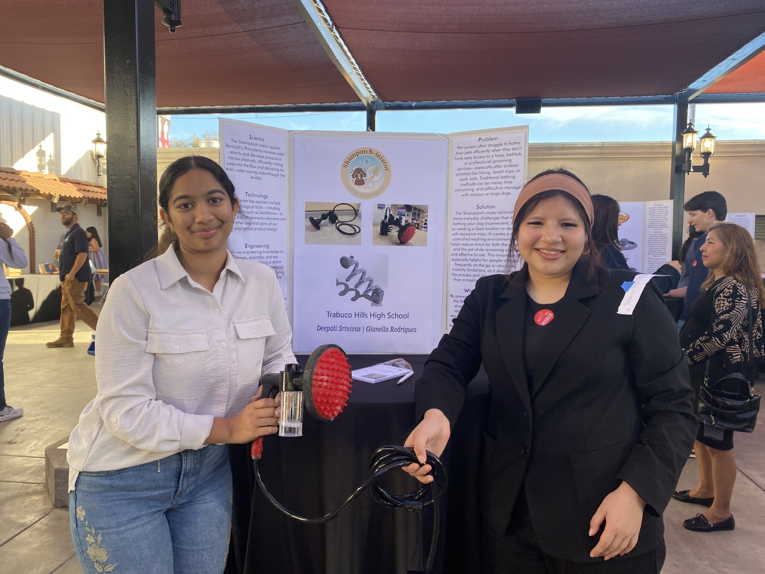 Saddleback Valley Unified School District students Deepali Srinivas and Gianella Rodriguez showcase their honored project, "ShamPOOCH-inator" at the OcMaker Meet the Maker event Feb. 27. 