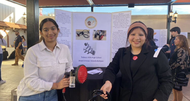 Saddleback Valley Unified School District students Deepali Srinivas and Gianella Rodriguez showcase their honored project, "ShamPOOCH-inator" at the OcMaker Meet the Maker event Feb. 27.