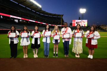 The eight recipients of the 2026 Angels Scholar awards pose for a photo at Angel Stadium. Each student received a $10,000 college scholarship through the Angels Baseball Foundation.