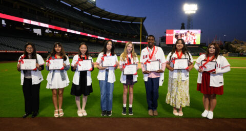 The eight recipients of the 2026 Angels Scholar awards pose for a photo at Angel Stadium. Each student received a $10,000 college scholarship through the Angels Baseball Foundation.
