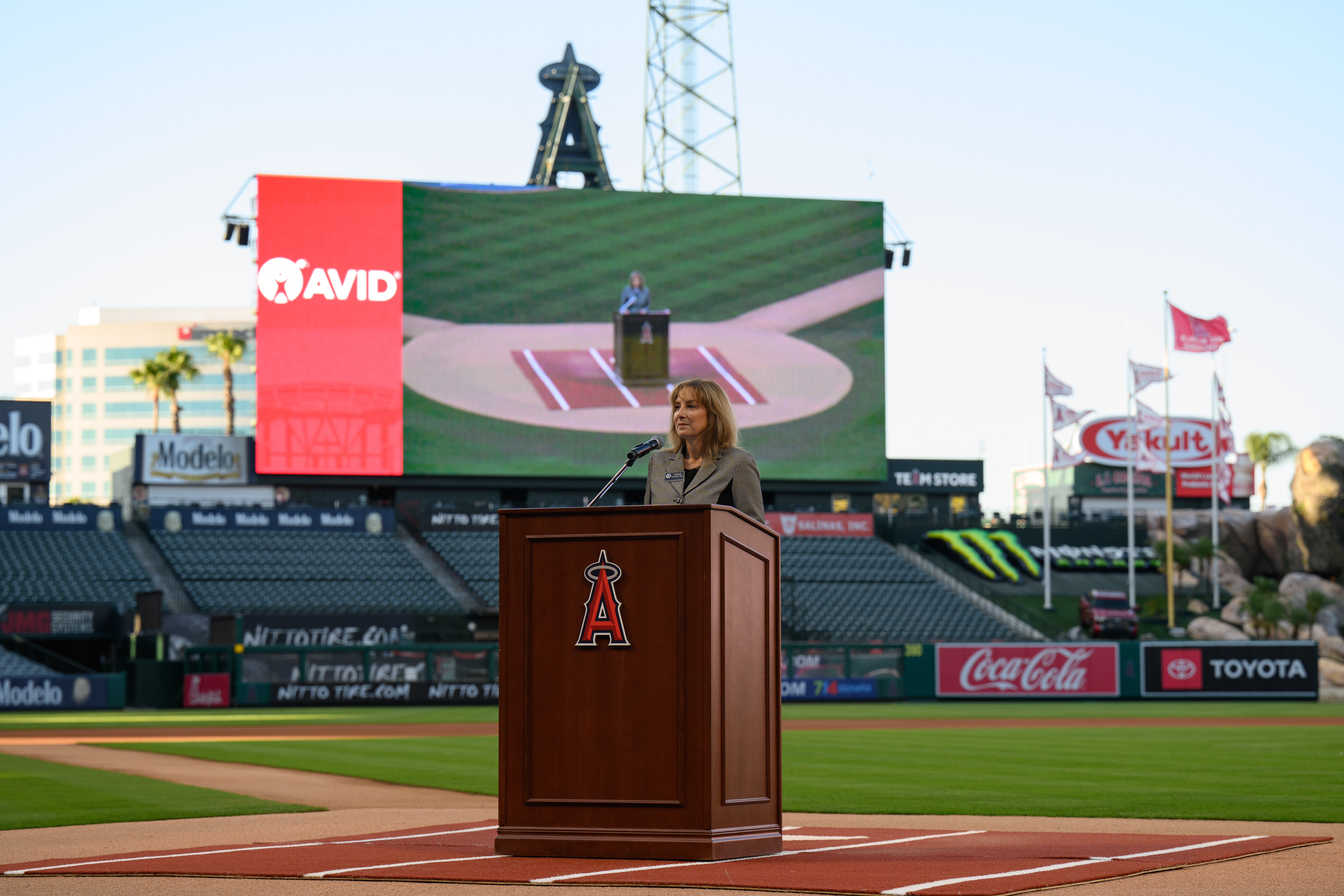 Dr. Denise Harshman, coordinator of Advancing Learning at the Orange County Department of Education, delivers remarks during the 2026 AVID 8th Grade Standout Recognition ceremony at Angel Stadium.