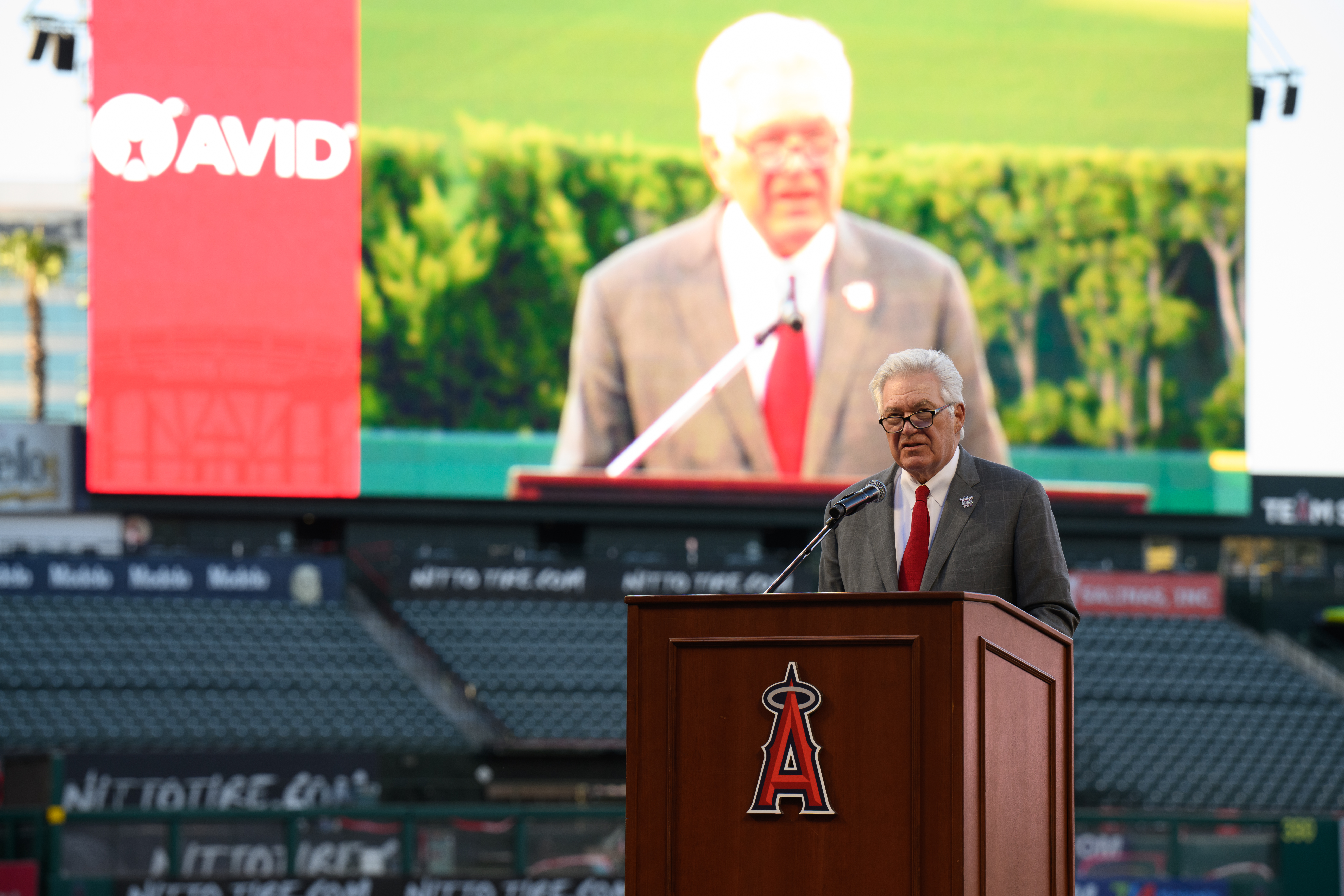 Dennis Kuhl, chairman of Angels Baseball, delivers remarks during the 2026 AVID 8th Grade Standout Recognition ceremony at Angel Stadium.