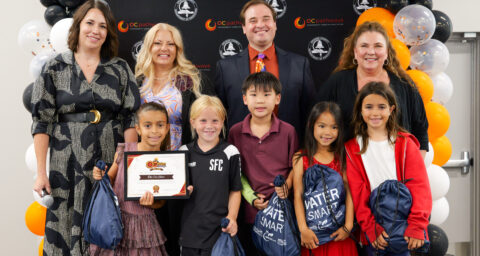 Tustin Memorial Academy students Vivienne, Cora, Miles, Maddie and Delnia win first place and the community-focused award from the Municipal Water District of OC for their dynamic prototype called "The Cat Robot."