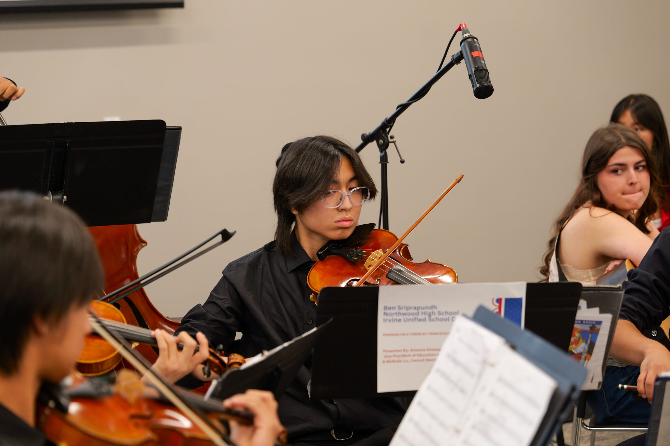 A student performs his award-winning classical composition during the USA 250-OC Theme Song Competition showcase.