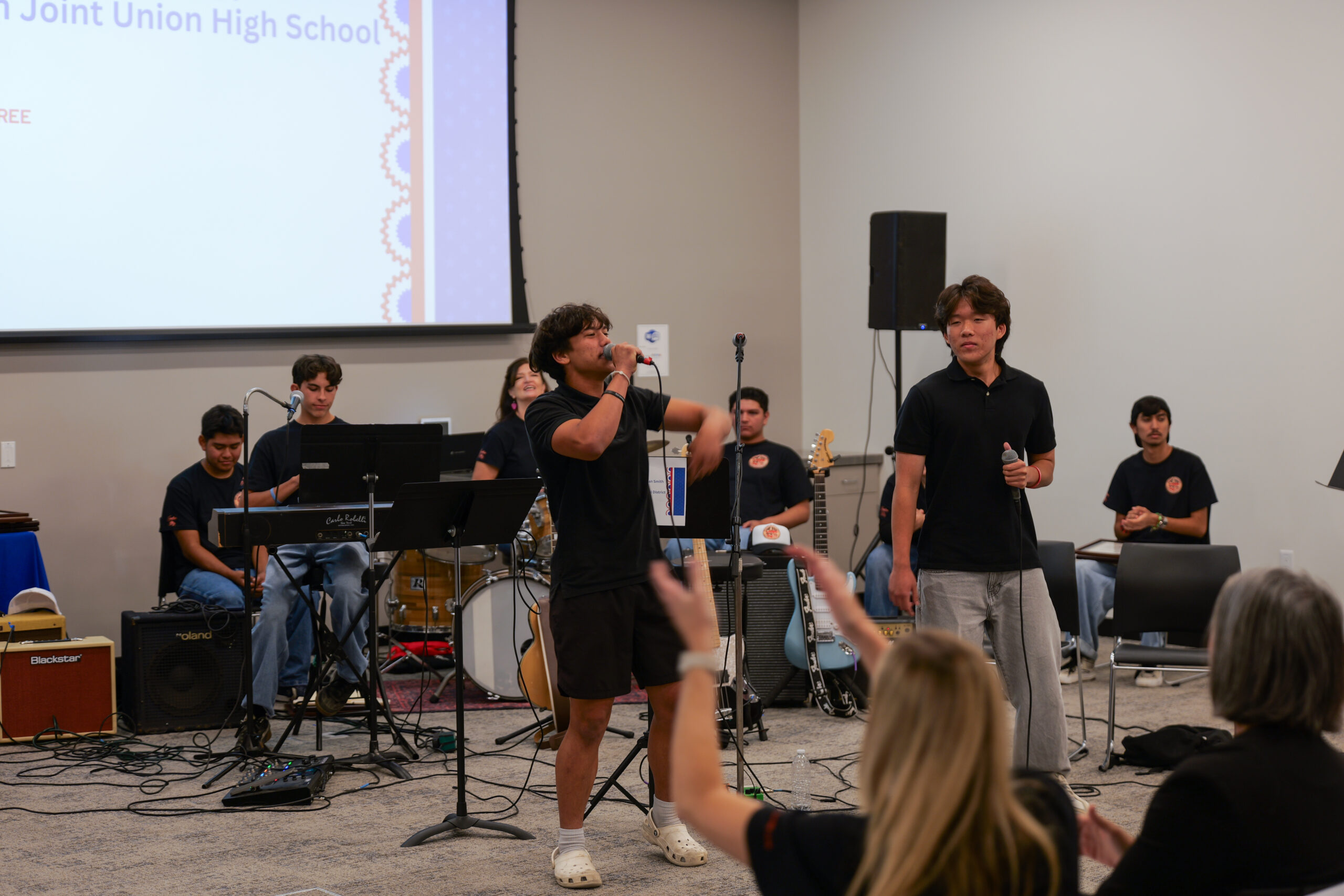 Two student vocalists perform "Land of the Free" during the USA 250-OC Theme Song Competition showcase.