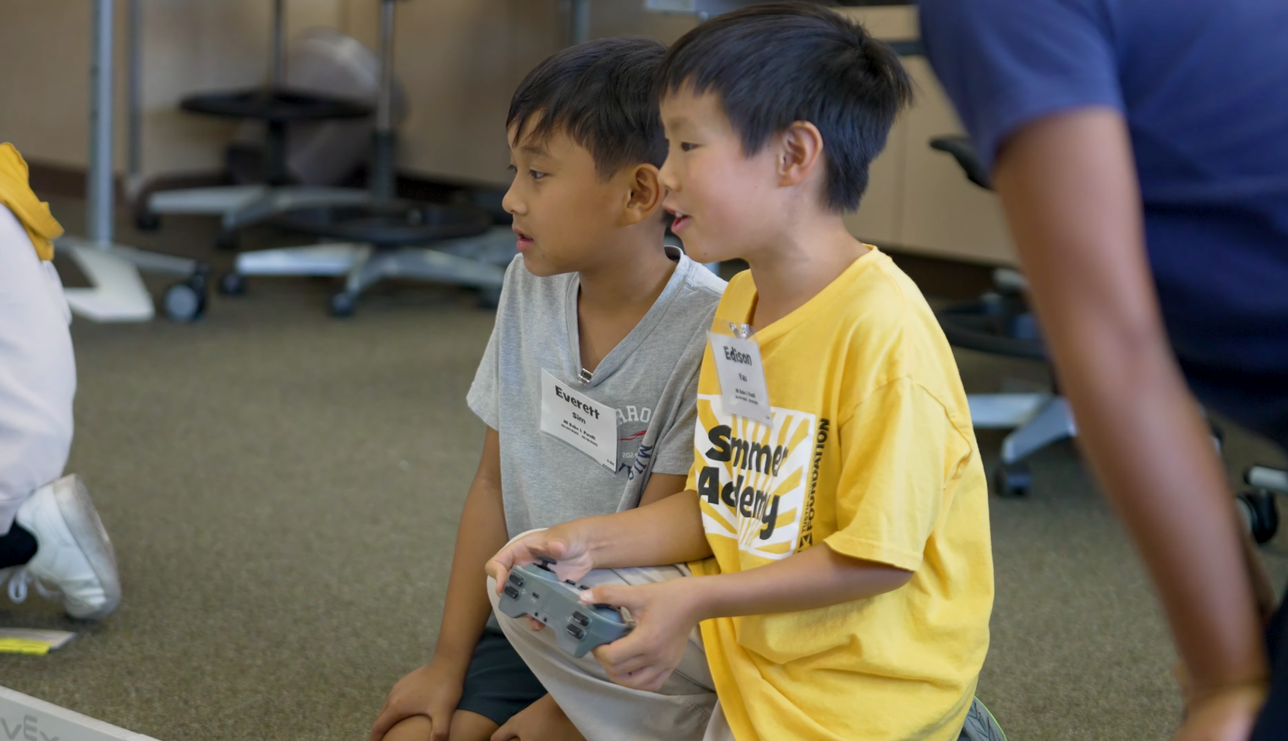 Students participate in a robotics activity during the Tustin Summer Academy, where campers explore hands-on learning experiences beyond the traditional school curriculum.