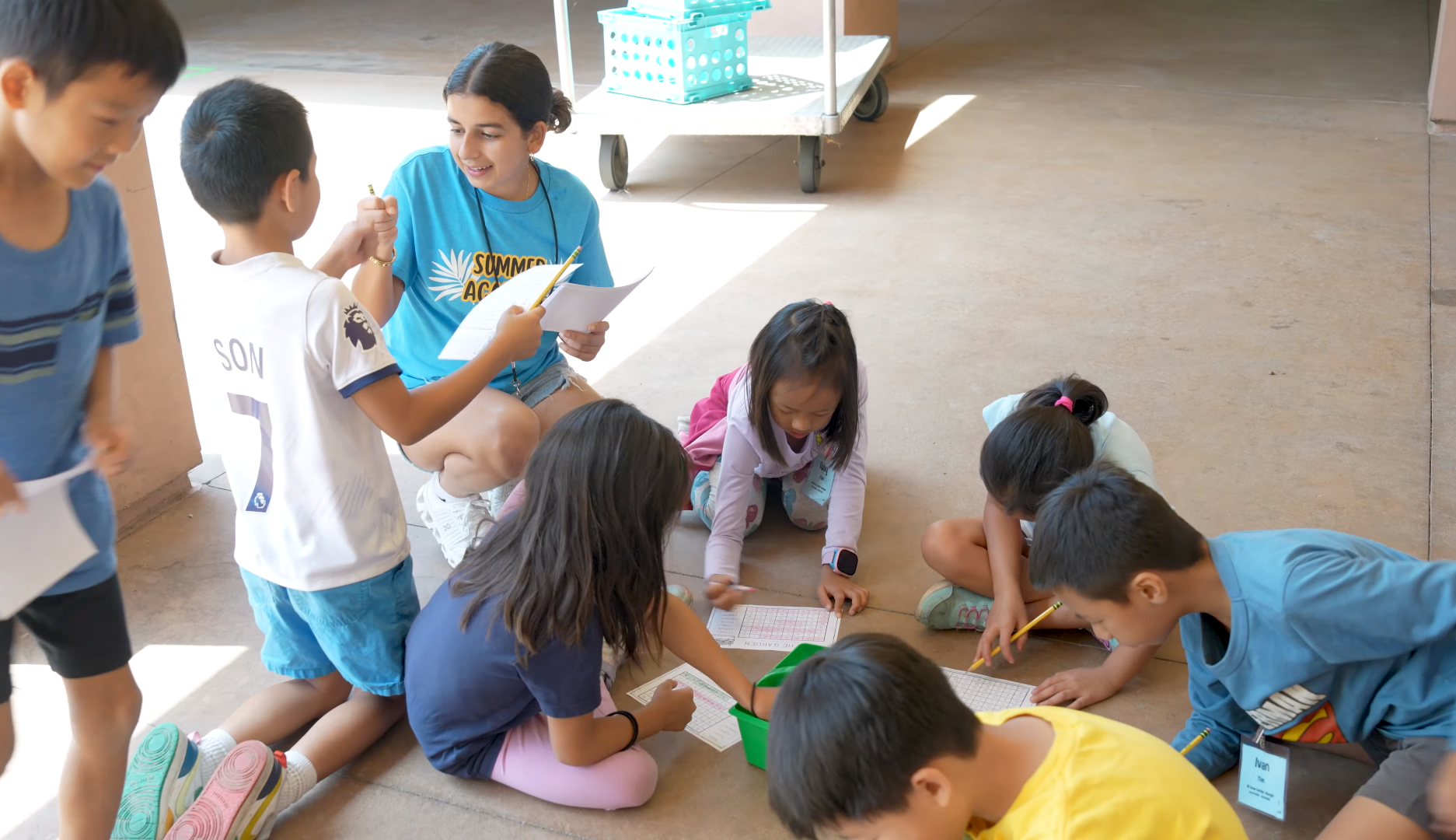 A student mentor works with campers during the Tustin Summer Academy, a summer enrichment program that has served thousands of students since its launch in 2011.