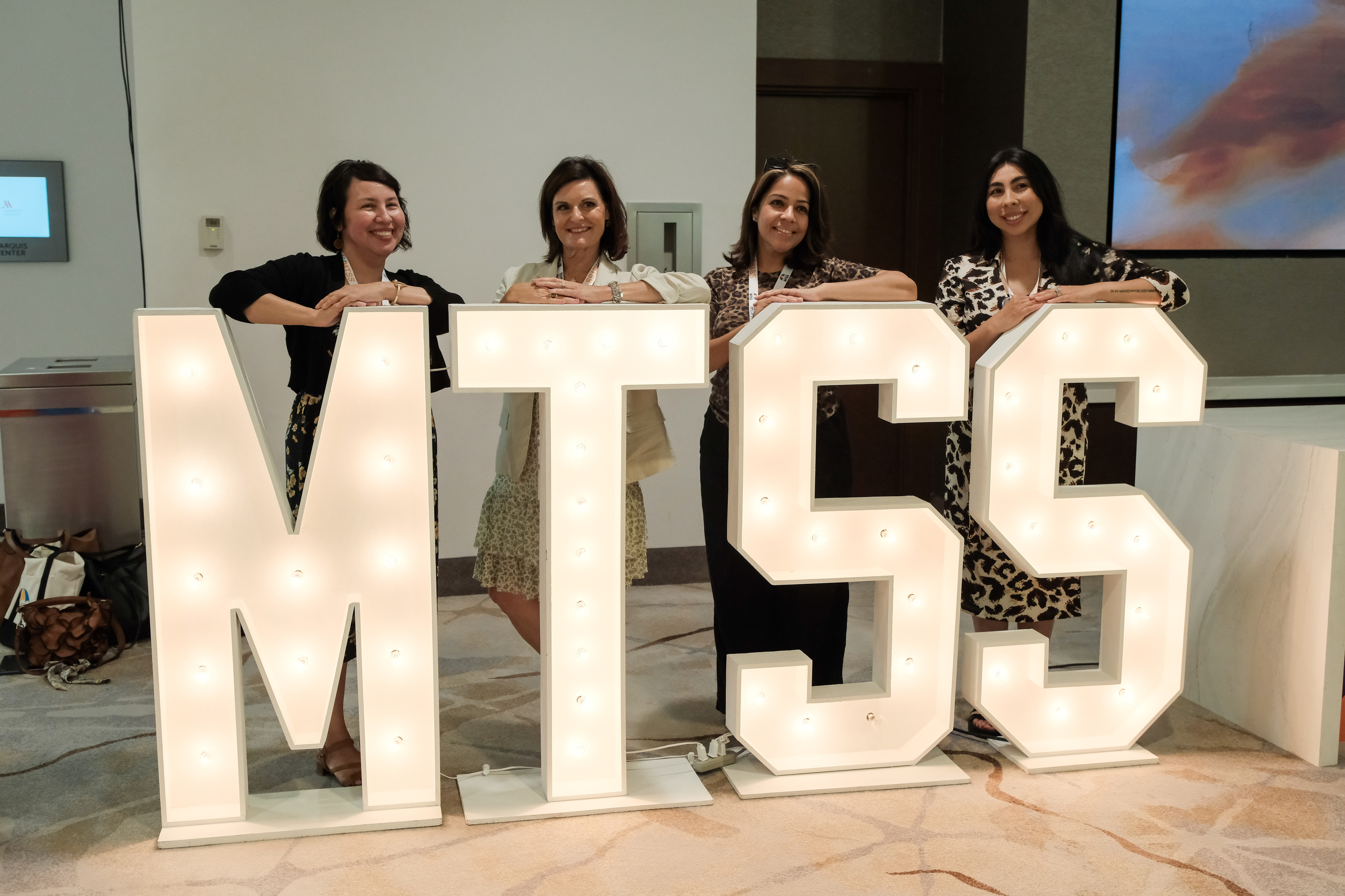 Attendees pose with illuminated MTSS letters during the California Multi-Tiered System of Supports Professional Learning Institute in Anaheim, where more than 2,300 educators and education professionals gathered July 14-16 to share strategies for building stronger systems of support for students.