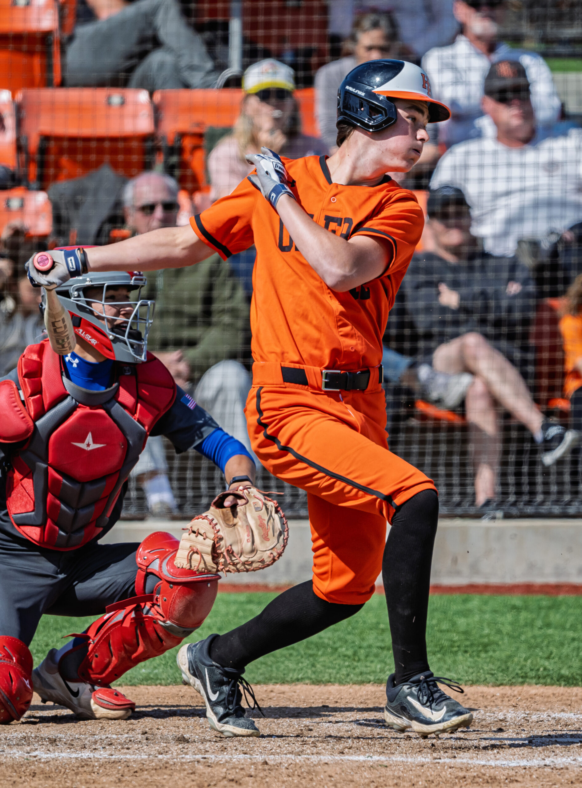 Jared Grindlinger pitching in a game for Huntington Beach High School against Los Alamitos High School. (Photo courtesy of HBUHSD)