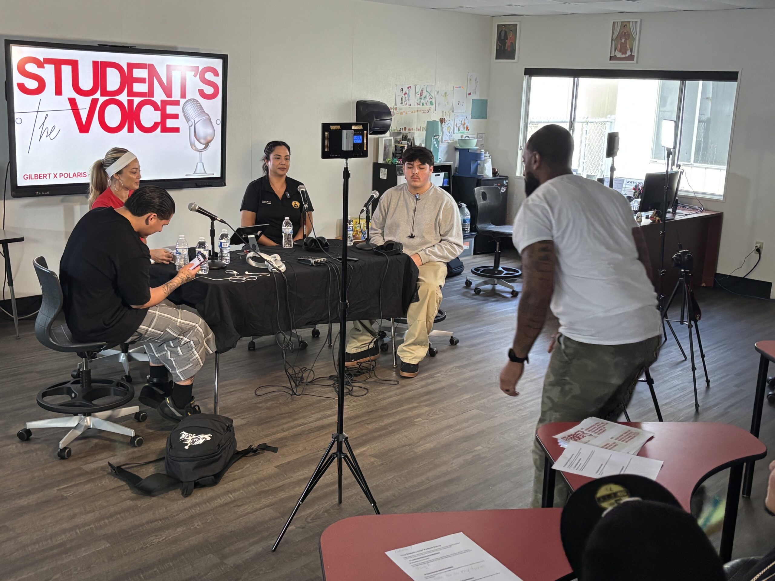 Gilbert Continuation High School students and staff record an episode of the school's "Student's Voice" podcast. From left are student Val Castro, teacher Jenni Cam, Community Schools Coordinator Krystel Miranda, student Sal Soria and teacher Arthur Russell. 