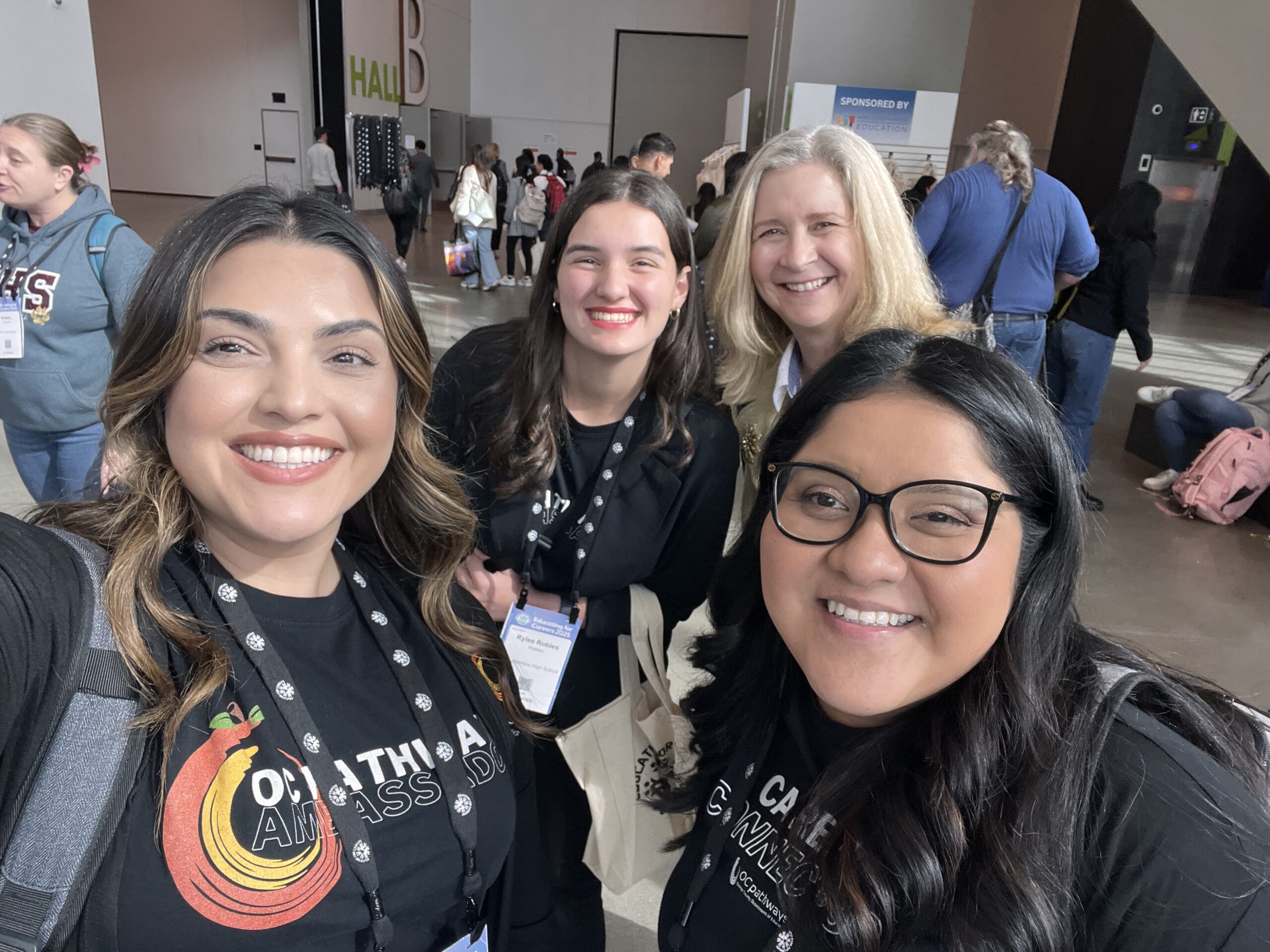 Student ambassador alumni Rylee Robles attends an educational conference alongside OC Pathways project managers Nadia Khodadadi and Pilar Comparan.