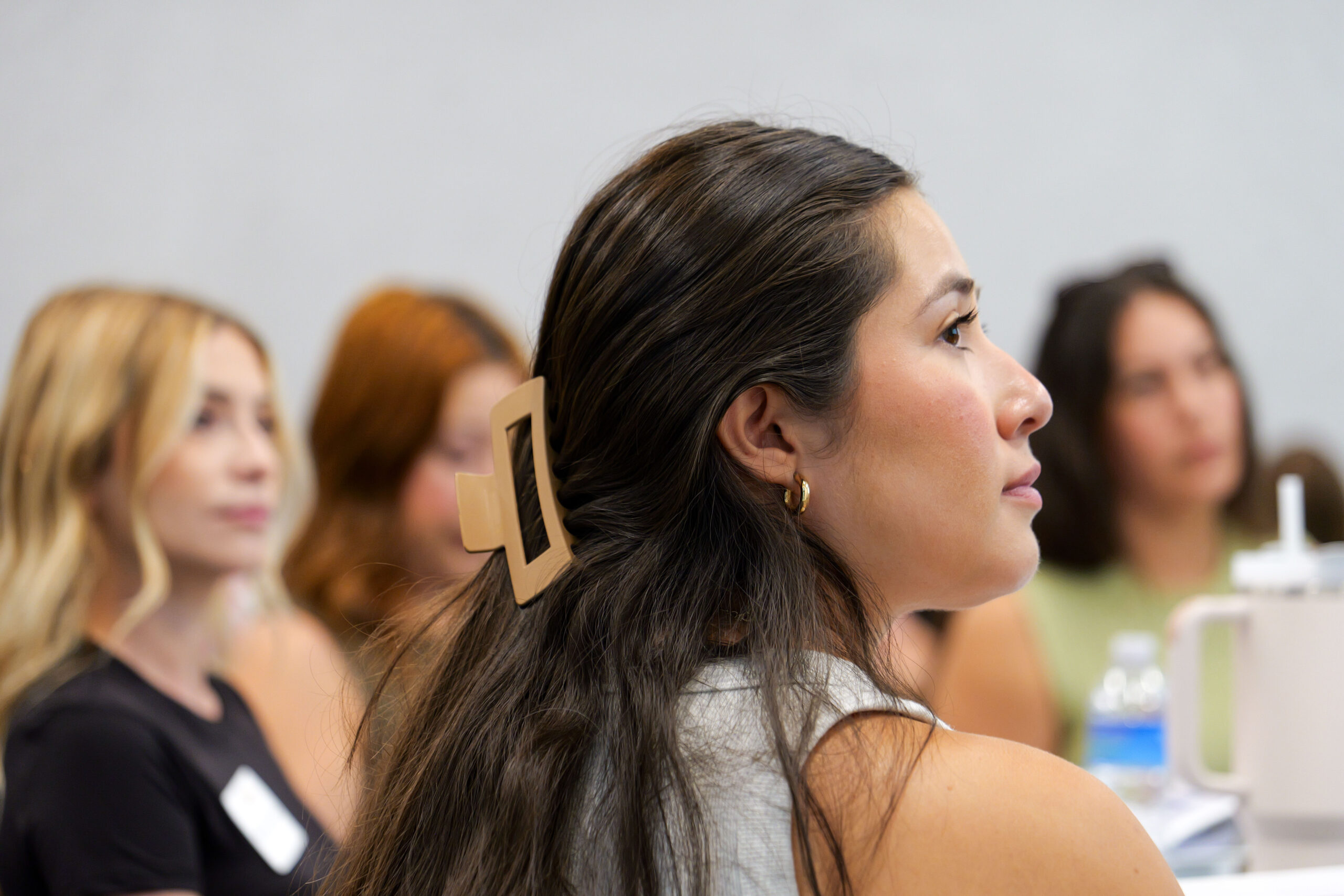 Participants listen attentively during a literacy training session at the OCDE Conference Center.