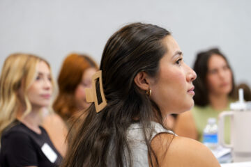 Participants listen attentively during a literacy training session at the OCDE Conference Center.