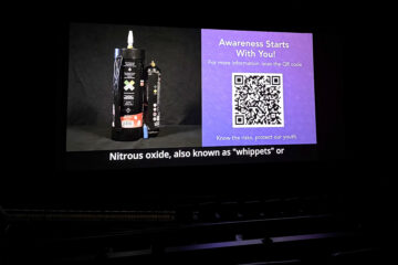 A public service announcement produced by the Orange County Department of Education plays before a movie at Regal Garden Grove, raising awareness about the risks of nitrous oxide misuse.