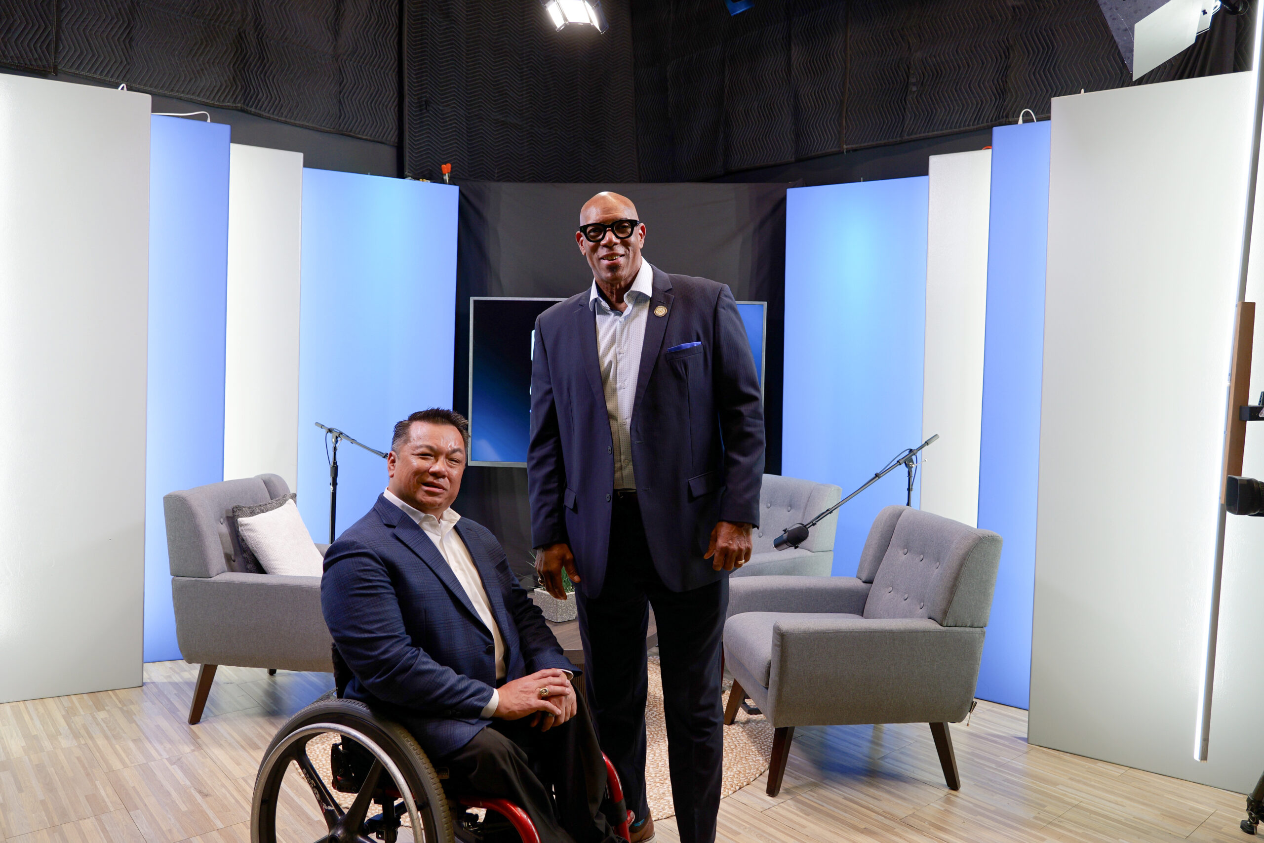 Orange County Superintendent Dr. Stefan Bean and Marvin Smith pose together in a studio
