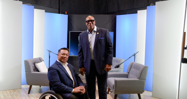 Orange County Superintendent Dr. Stefan Bean and Marvin Smith pose together in a studio