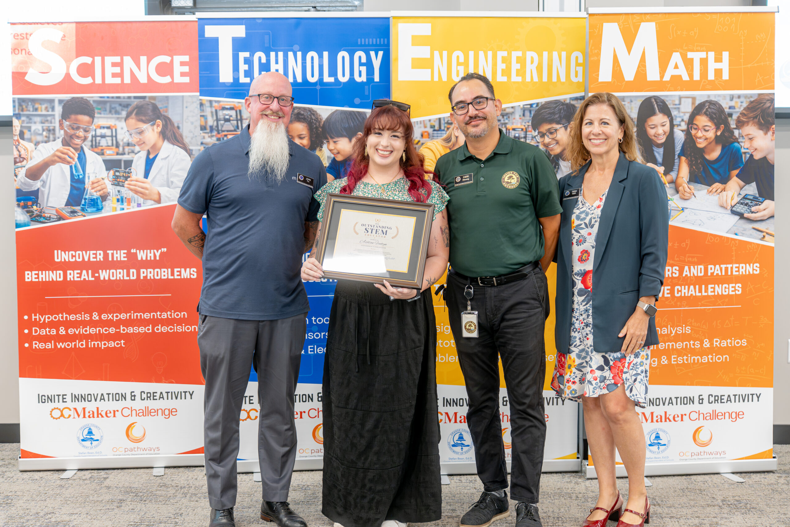 Ashton Fontyn of Robert M. Pyles STEM Academy in the Magnolia School District receives an Outstanding K-12 STEM Educator Award during the Aug. 4 celebration.