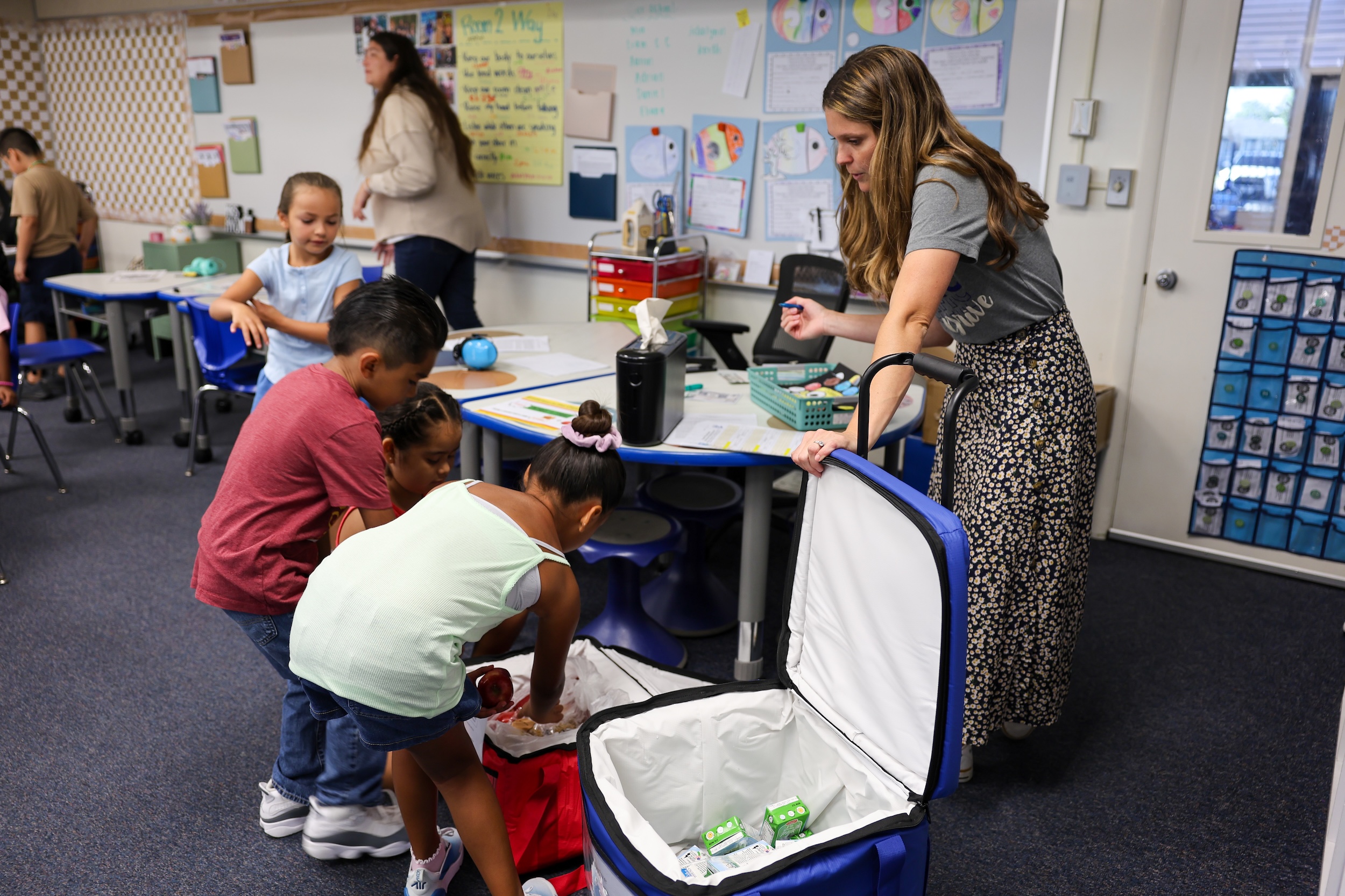 Pacific Drive Elementary School teachers help check in students for their morning meals as they select menu items on Aug. 17. (Fullerton School District)