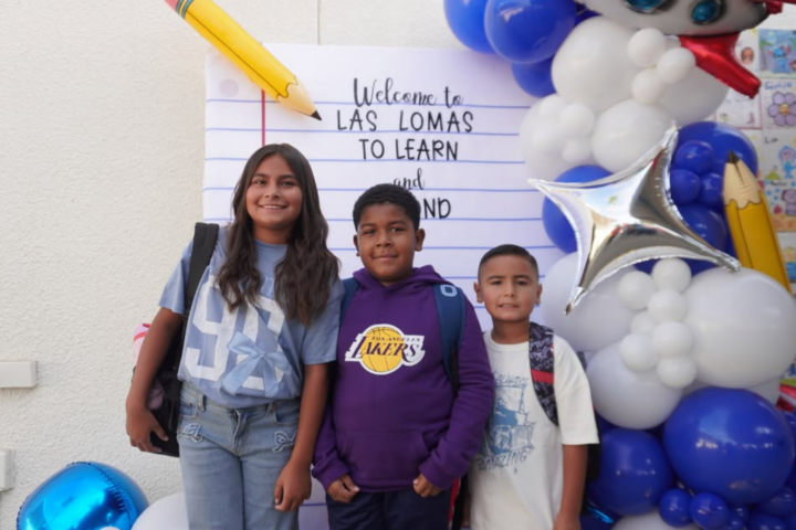 Students at Las Lomas Elementary School in La Habra are welcomed back to campus by taking photos in front of colorful school decorations. (Courtesy of La Habra City School District)