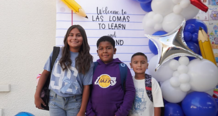 Students at Las Lomas Elementary School in La Habra are welcomed back to campus by taking photos in front of colorful school decorations. (Courtesy of La Habra City School District)