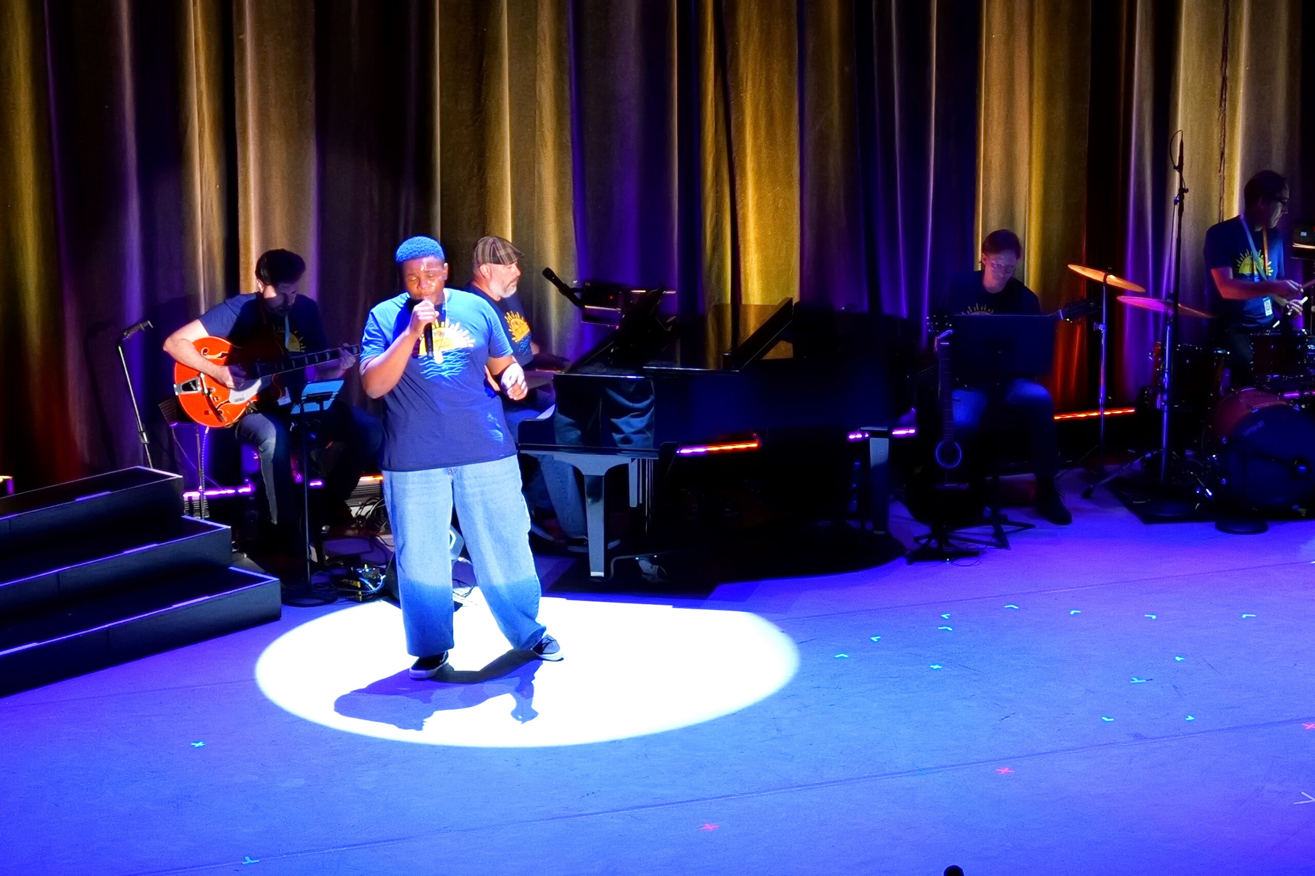 One student sings a solo at Summer at the Center 2026.