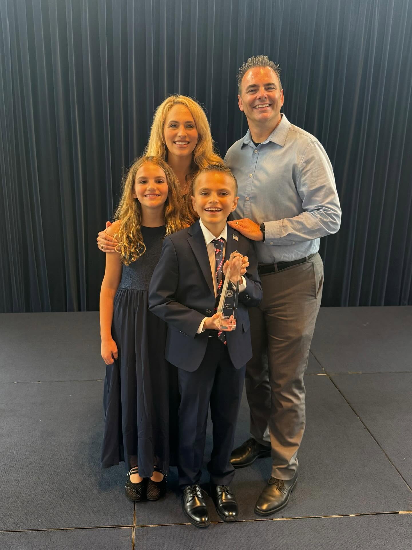 Logan Thielen, center, celebrates his first-place finish at the California National Civics Bee with his sister, Olivia, and parents, Jenna and Mike Thielen. The state competition was held June 27 at the Ronald Reagan Presidential Library in Simi Valley.