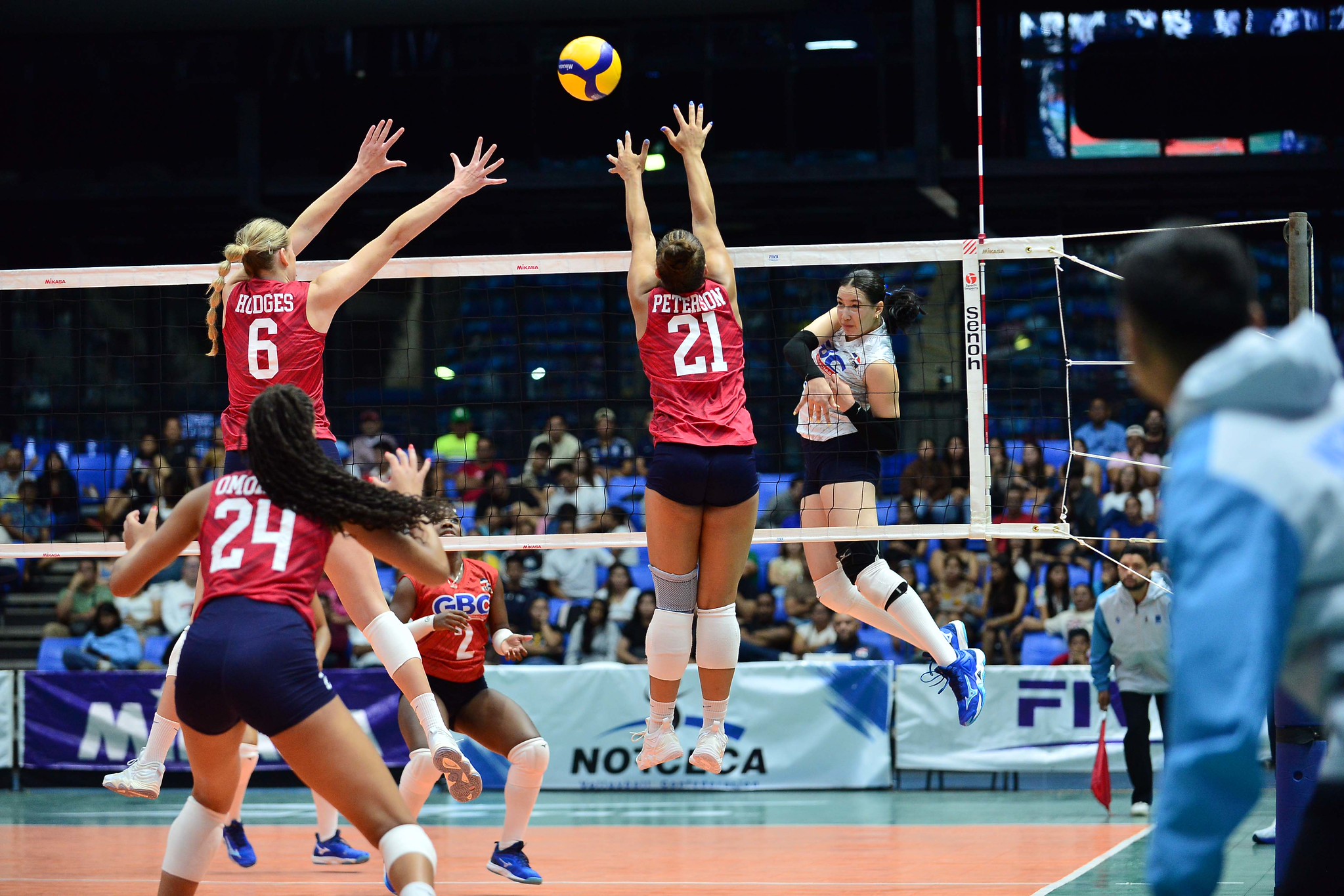 Middle/outside blocker Megan Hodges (6) attempts a block in the gold medal match against the Dominican Republic at the NORCECA U23 Pan Am Cup in Managua, Nicaragua.