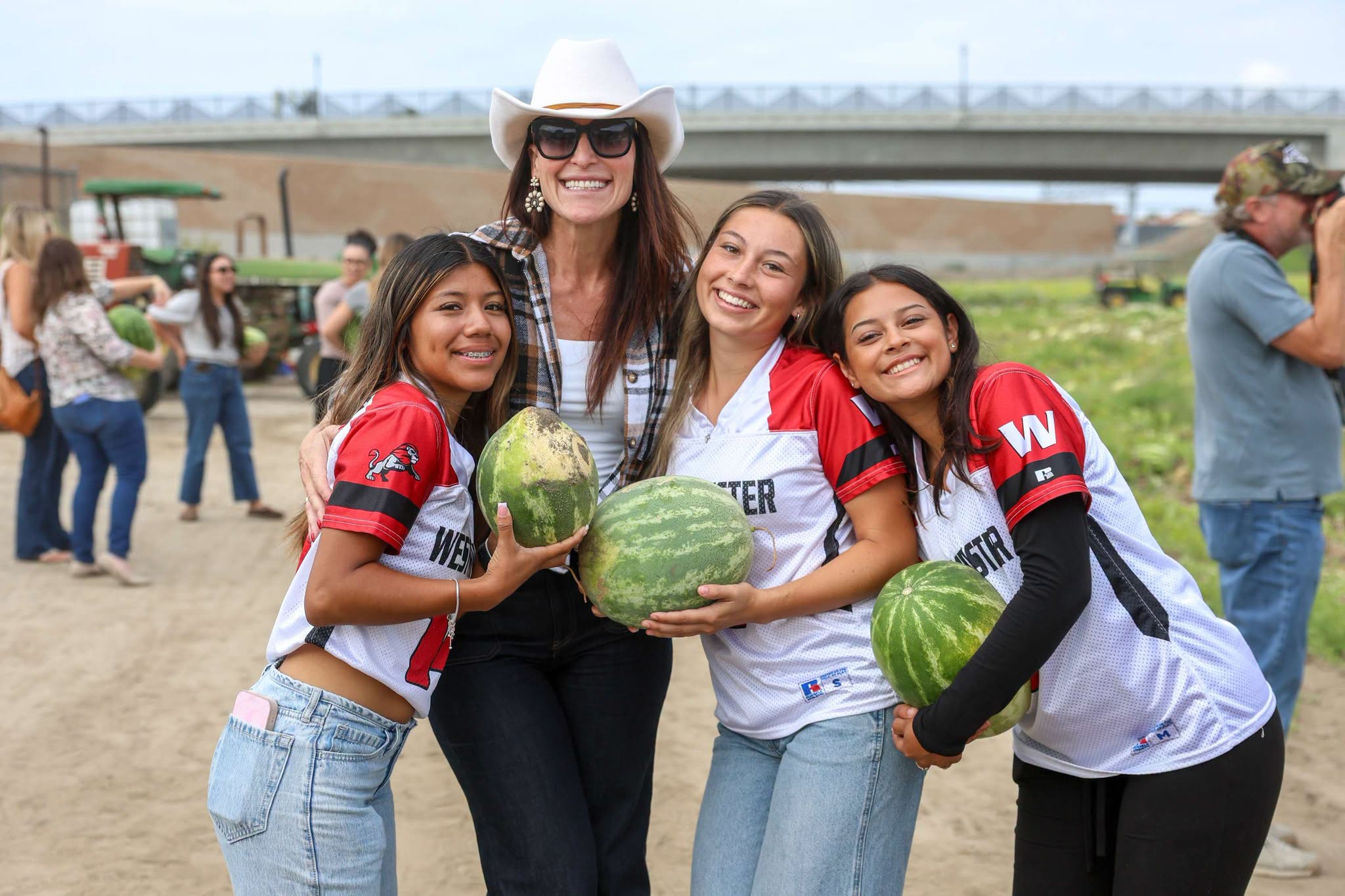 Westminster High School Principal Amy Sabol joins students during the Giving Farm’s annual watermelon harvest.