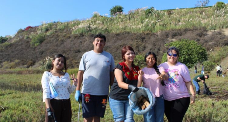Volunteers take part in a previous California Coastal Cleanup Day at Upper Newport Bay in Newport Beach.