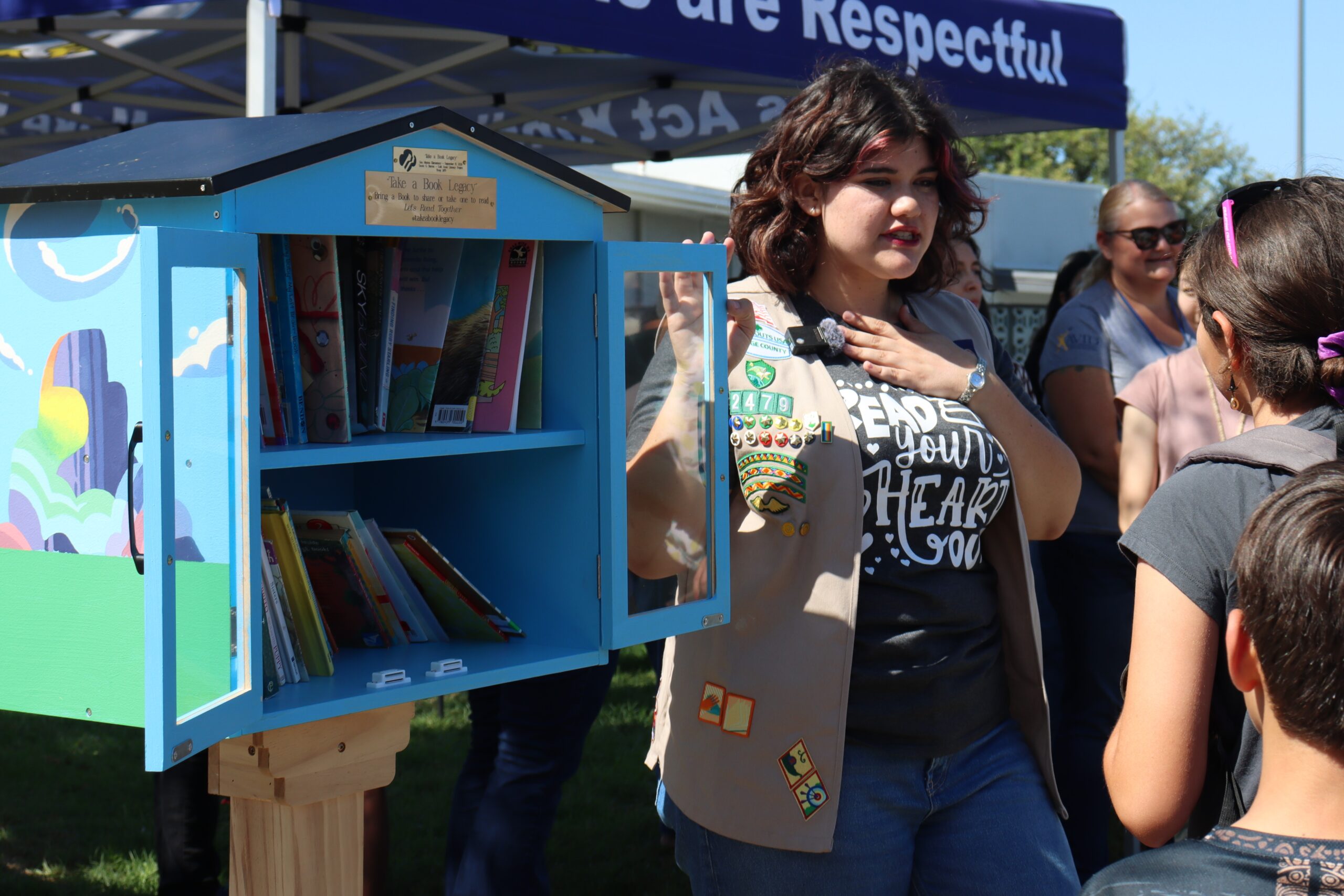 Former Centralia Elementary School District student Sarah Barron speaks to students at San Marino Elementary School about the new free library available on their campus. (Centralia Elementary School District)