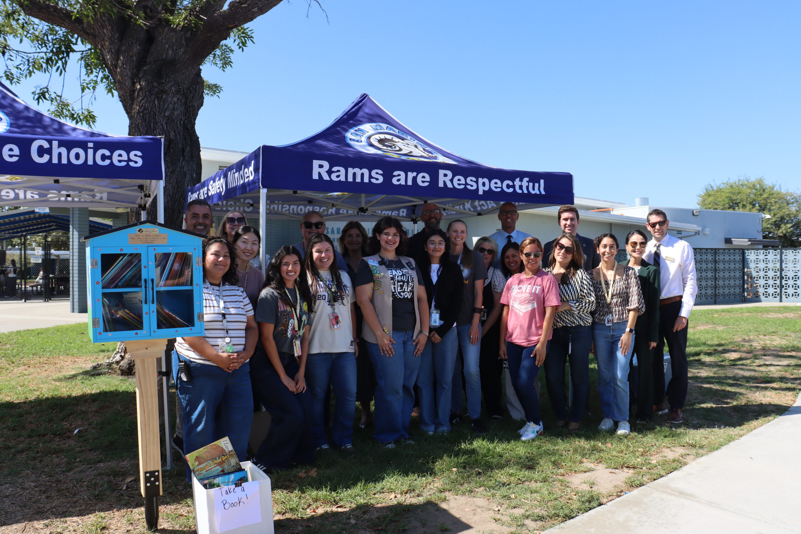 Cypress College student Sarah Barron is joined by Centralia Elementary School District Superintendent Norma Martinez, San Marino Elementary School Principal Daniel Gonzalez, Buena Park Mayor Connor Traut and school staff for the unveiling of the Little Free Library at San Marino Elementary Sept. 15.
