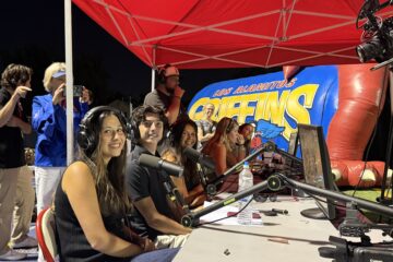 Los Alamitos High School students work behind the microphones during the school’s first student-produced live varsity football broadcast on Sept. 4.