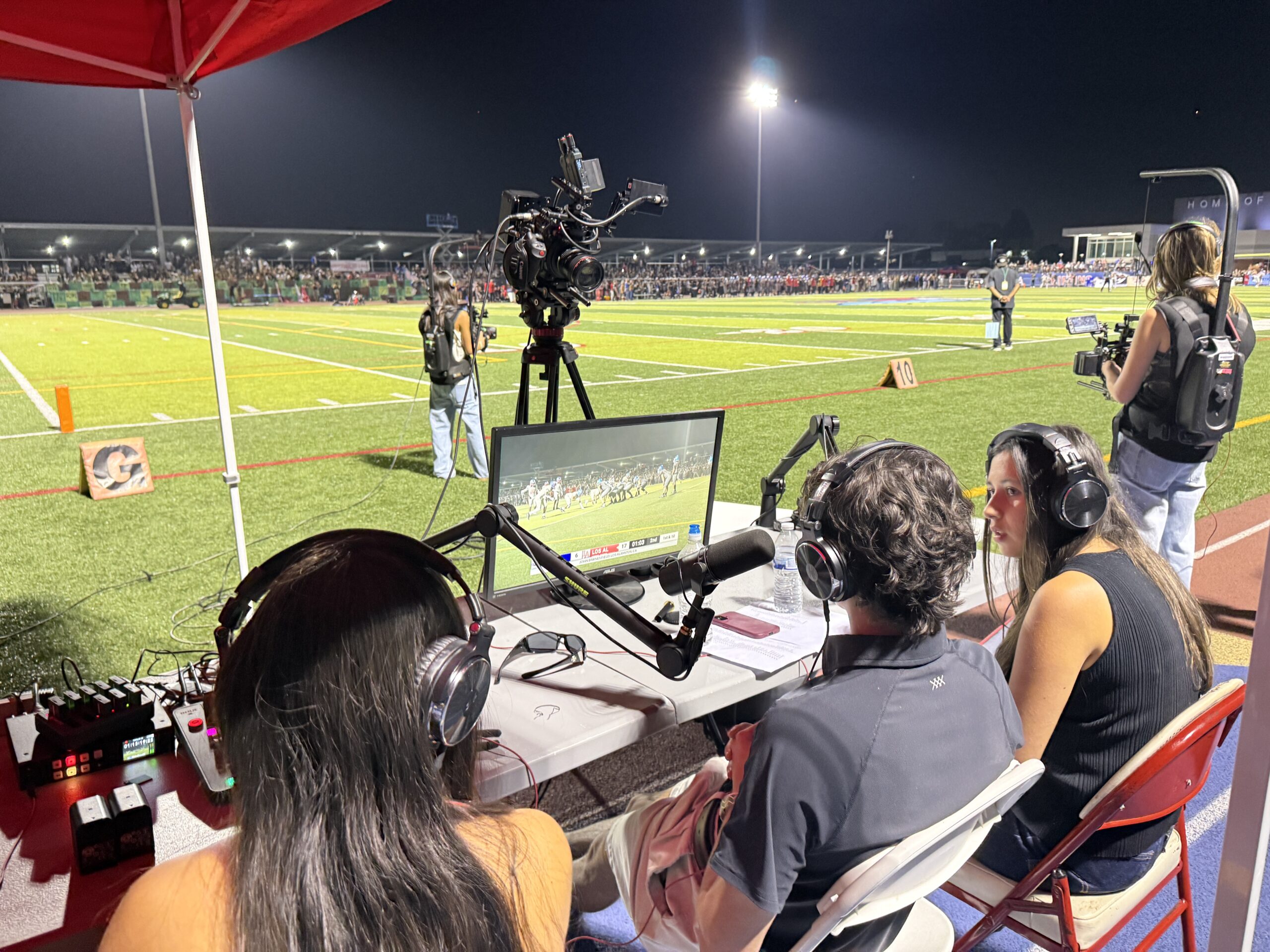 Los Alamitos High School students work from the sidelines to produce live coverage of the Griffins’ varsity football game against Junipero Serra High School on Sept. 4.