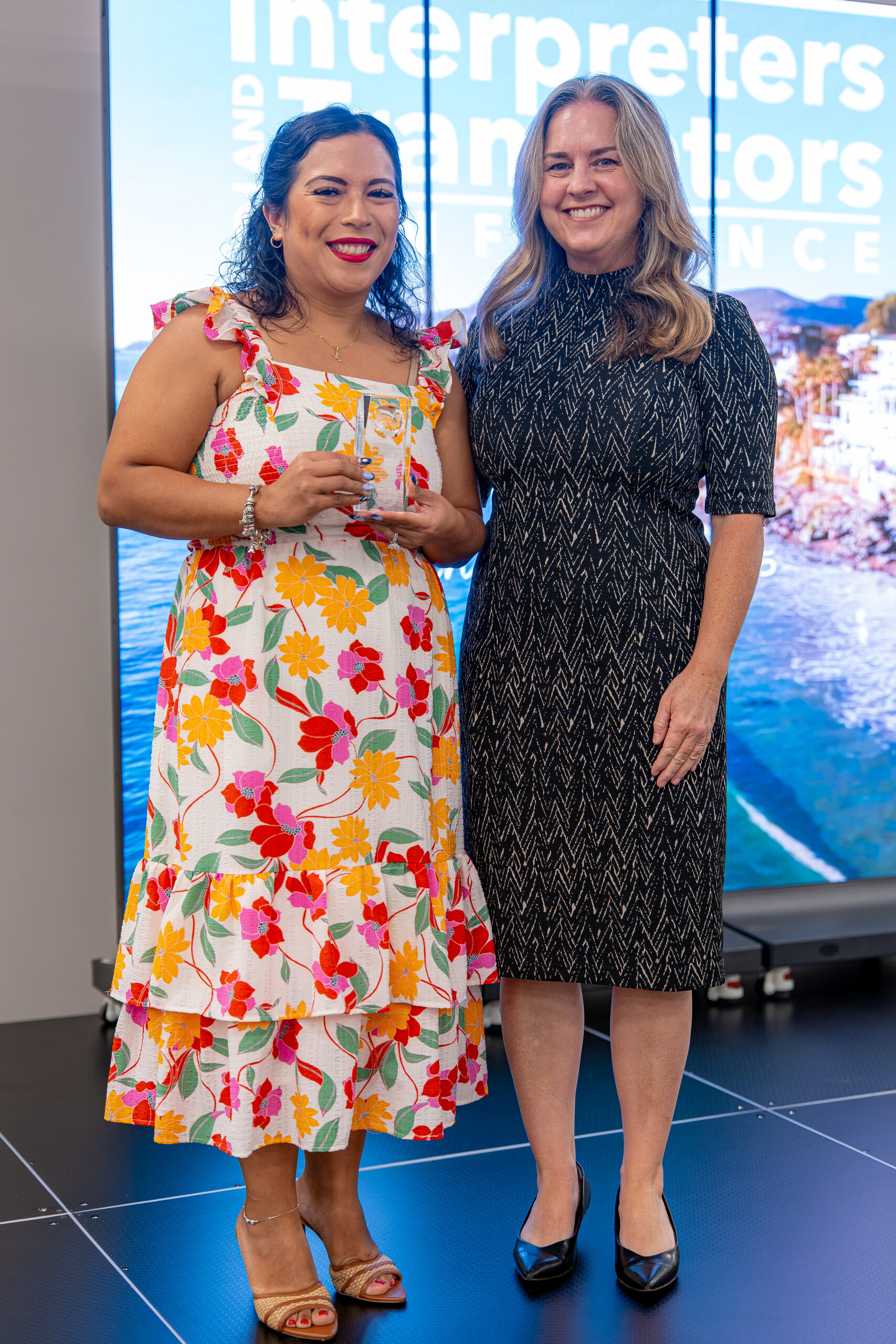 Jasmin Anaya of the Anaheim Elementary School District, left, receives a 2026 Multilingual Award of Distinction alongside Stacy Deeble-Reynolds, OCDE executive director of Student Initiatives, Partnerships and Events.