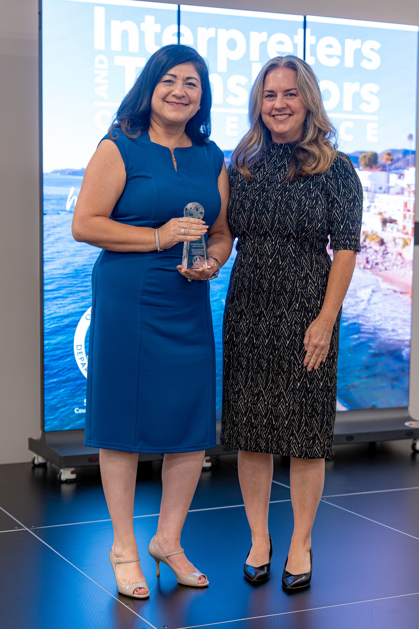 Dr. Erlinda Soltero-Ruiz of the Fullerton School District, left, receives the 2026 Language Access Administrator of the Year award alongside Stacy Deeble-Reynolds, OCDE executive director of Student Initiatives, Partnerships and Events.